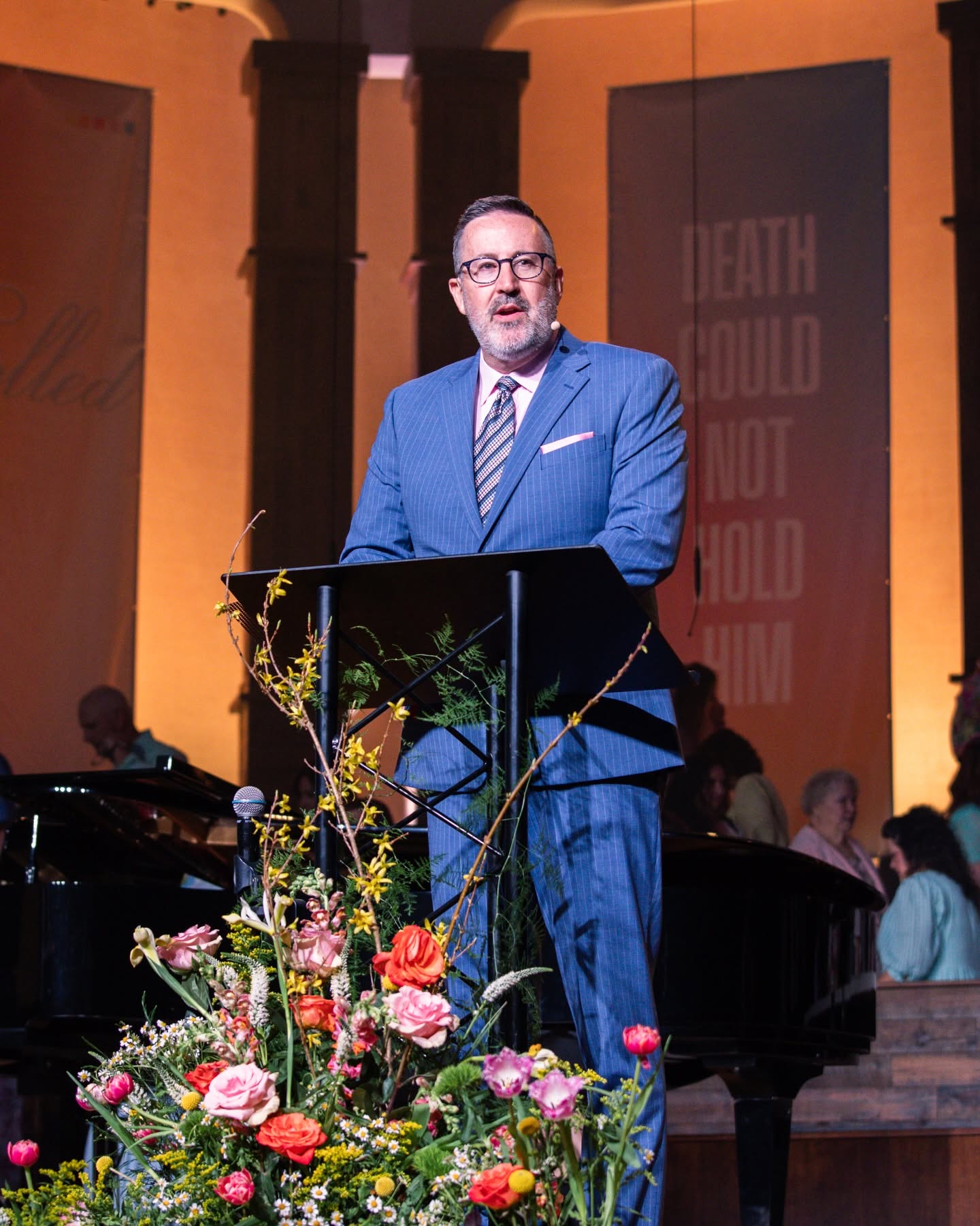 Dr. Wayman Ming Jr. preaching from the platform at Bethesda Community Church